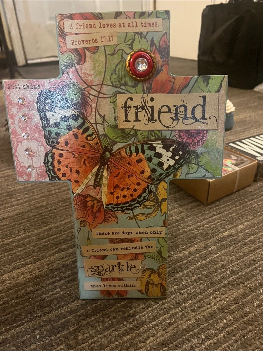 This is a wooden stand up cross with Biblical Verses about love of friends.